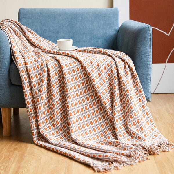 Couvre lit orange fauteuille gris